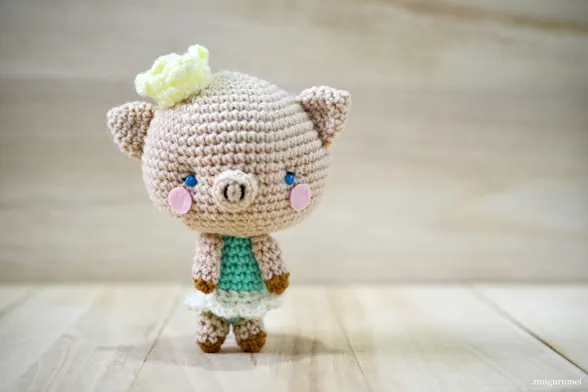 Get the free crochet pig pattern to make the world cutest Amigurumi Pig, Princess P. She is a 5" tall stuffed pig wearing a ballerina skirt & a princess crown.