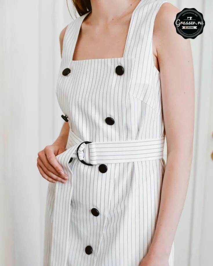 This sleeveless semi-formal dress is suitable for both work and play! The front of the bodice features two rows of buttons that form a closure down the fitted dress. It also has a ribbon strap tied around the waist to give it a cinched waist look.