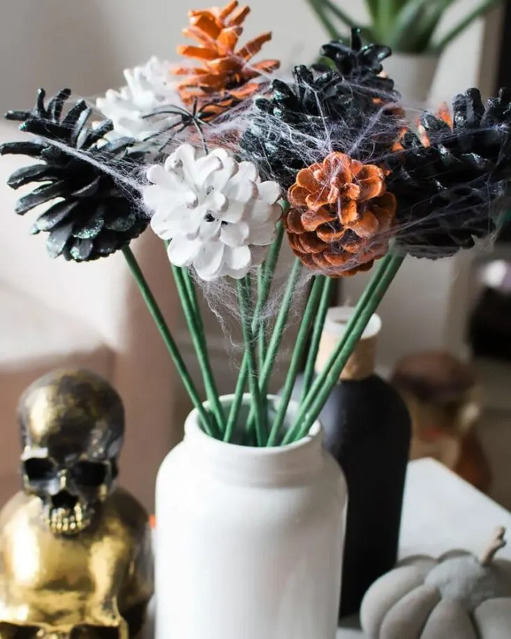 Turn some prickly and itchy pine cones into a bouquet of flowery goodness! We love the fact that pine cones are used as they add a natural touch. Just sprinkle some webs on them for a Halloween touch!