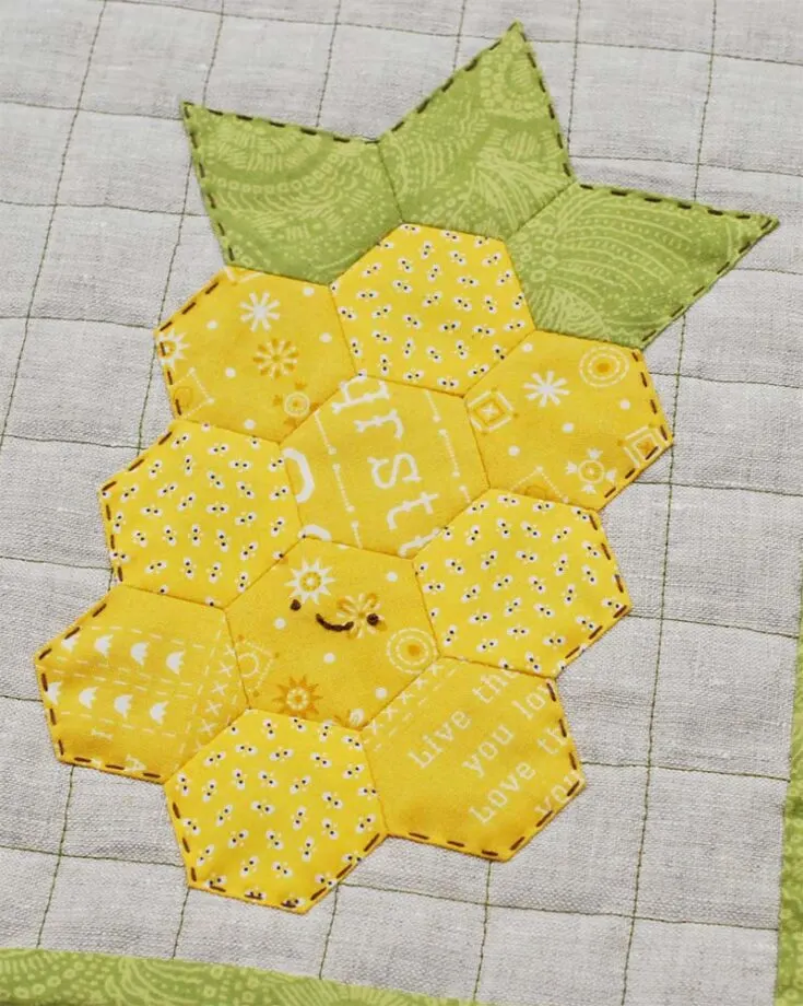 You can make a pineapple quilt block out of yellow and green scrap fabrics, as well as 10 hexagons and 3 jewel EPP templates. What a clever idea!