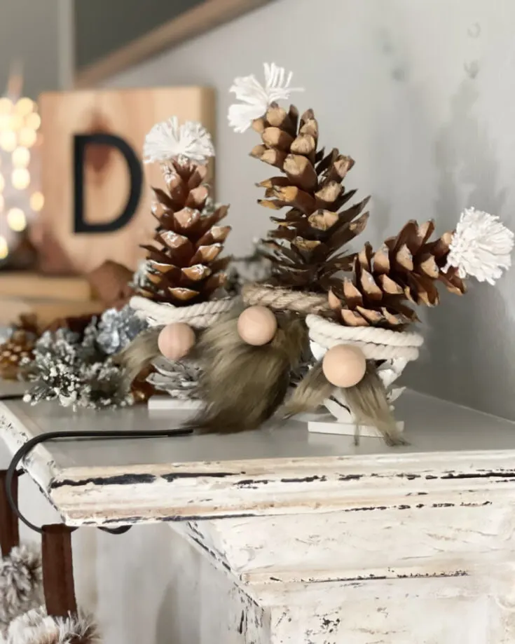 Haha! We love how cute and creative crafts can get. Using a pine cone, incorporate it into the craft making cute table-side gnomes that huddle together. We love the added touch of nature here!