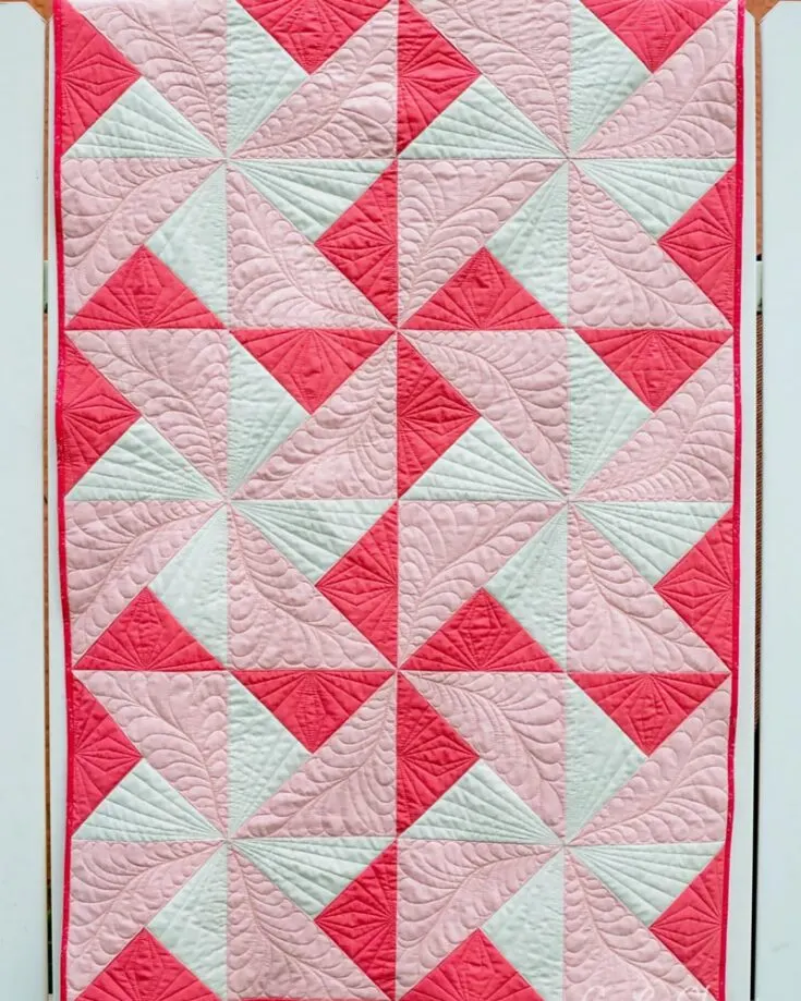 Like the Turnstile quilt, this Pinwheel Daydreams offers a fun vibe to your quilting repertoire! It&rsquo;s a delightful piece that mixes pinwheel blocks with soothing pastel fabrics, creating a quilt perfect for a nursery or a thoughtful handmade gift. Follow the step-by-step instructions, and you&rsquo;ll be on your way to creating a small lap quilt of 36&rdquo; x 54&rdquo;.