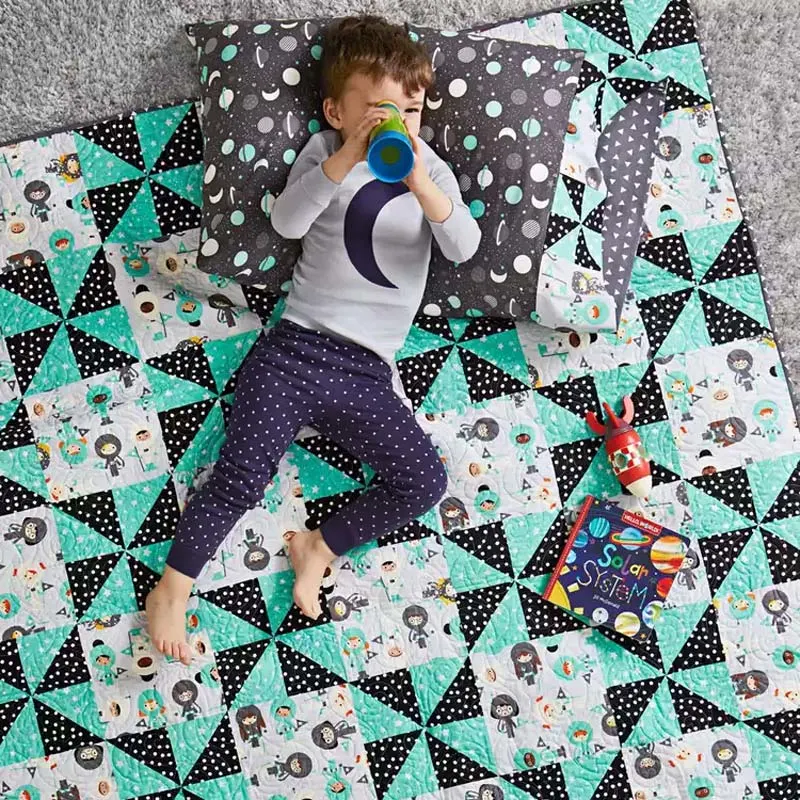 Try out this baby quilt design that comes in three sizes in the downloaded PDF! Made with charming pinwheel blocks and adorable animal appliques, quilt up a snuggly masterpiece that will delight both kids and adults at the same time. The finished quilt size is 56 &frac12;&rdquo; x 72 &frac12;&rdquo;.