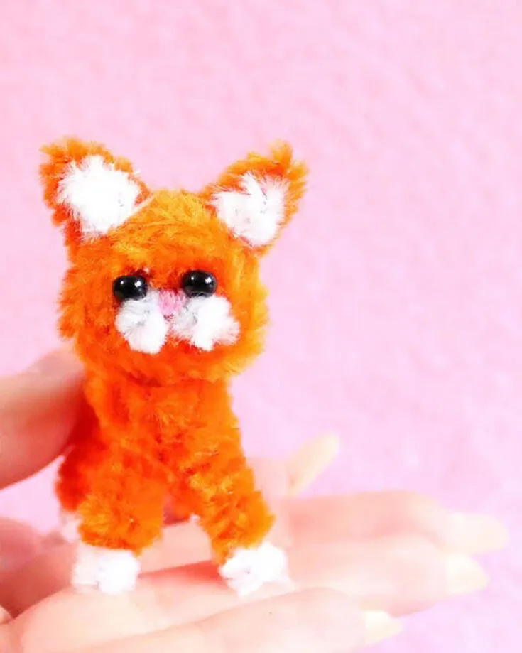 This simple yet delightful craft is sure to be a hit with cat lovers of all ages. Follow this short video tutorial to start crafting some fuzzy feline companions! Experiment with the colors of pipe cleaners for different colored cats.