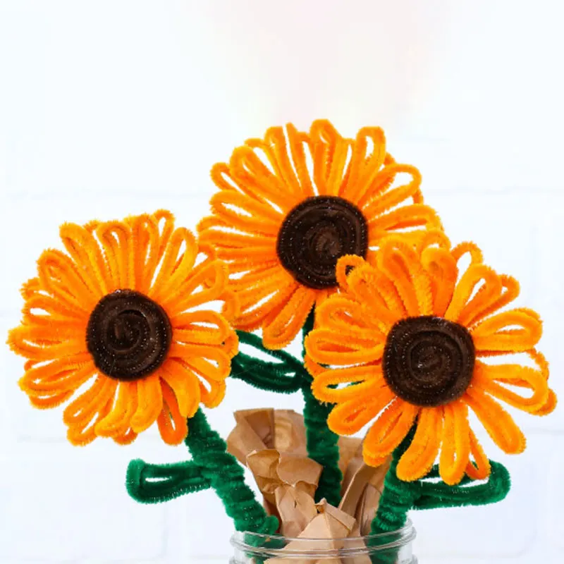 With their bold yellow petals and dark brown centers, these cheerful sunflower blooms are a vibrant addition to any floral arrangement.