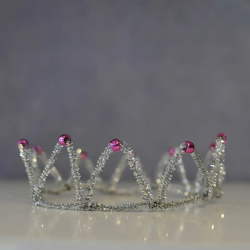 This fun-to-make pipe cleaner crown will make any wearer feel like royalty, whether they're attending a fancy ball or simply playing dress-up at home! Decorate it by adding sequins, beads, or ribbons.