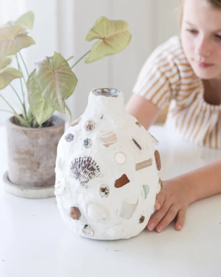 Turn your vacation souvenirs and keepsakes into a special keepsake vase by pressing them into plaster on a vase. Whether it&rsquo;s shells, coins, or old jewelry, this fun and slightly messy project lets you relive memories while creating something meaningful and beautiful.