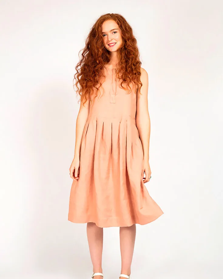 Bask in the sun's rays with this darling pleated dress from Peppermint Magazine! This boxy-style dress features hidden buttons and in-seam pockets! You'll be sewing bust seams and pleats into the skirt too. This pattern comes in ten different sizes!