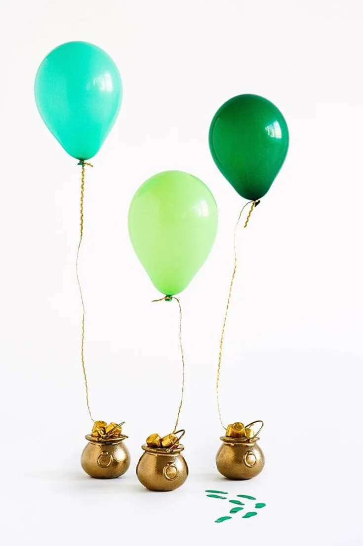 If you have some leftover cauldron decor from last Halloween, reuse them into these charming pot of gold balloon surprises. Watch out, as leprechauns might just come running through your front door.