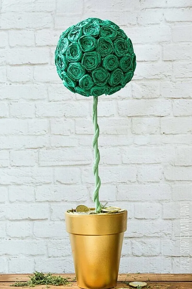 Though this particular design is a bit more crafty, the end results are worth the effort. Check out this gorgeous pot of gold topiary with around 50 rosettes, all combined and glued to a Styrofoam ball.