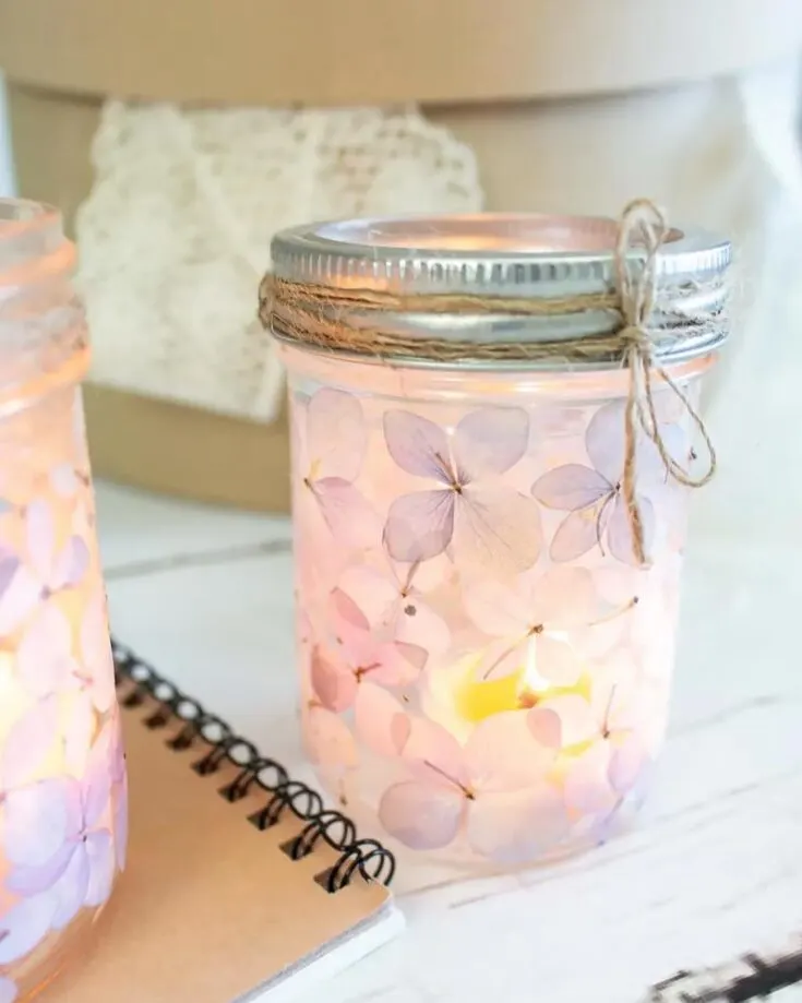 Do you want to light up your home in a fashionable way? This craft is perfect for you, pressing flowers into a jar with some candles. They make beautiful decor while serving their purpose of lighting up your home.