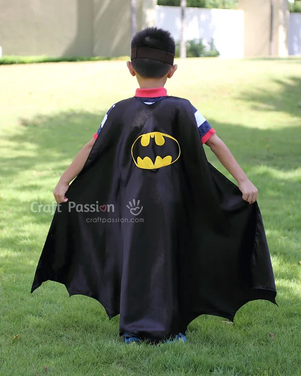 Create a Batman superhero cape with this easy cape sewing pattern in just one evening, featuring an inverted scallop bat wing hem.