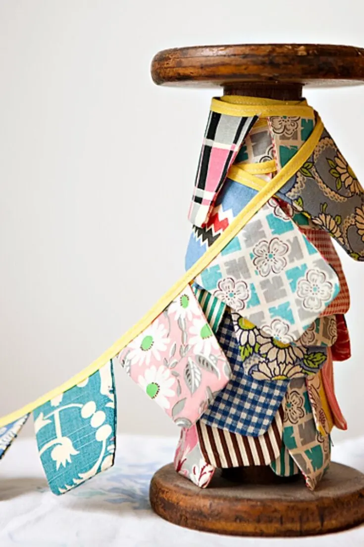 Looking for scrap fabric projects to decorate your home for a party? Use some of your scraps to sew a rustic looking bunting that you'll want to keep hung up all year round.