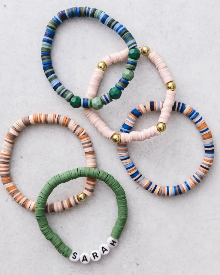 Here's a clay bead bracelet idea that you can try making! These bracelets are quick, easy to make, and packed with so much fun! Personalize your clay bracelets with letter beads spelling out your name, or add metallic gold beads.
