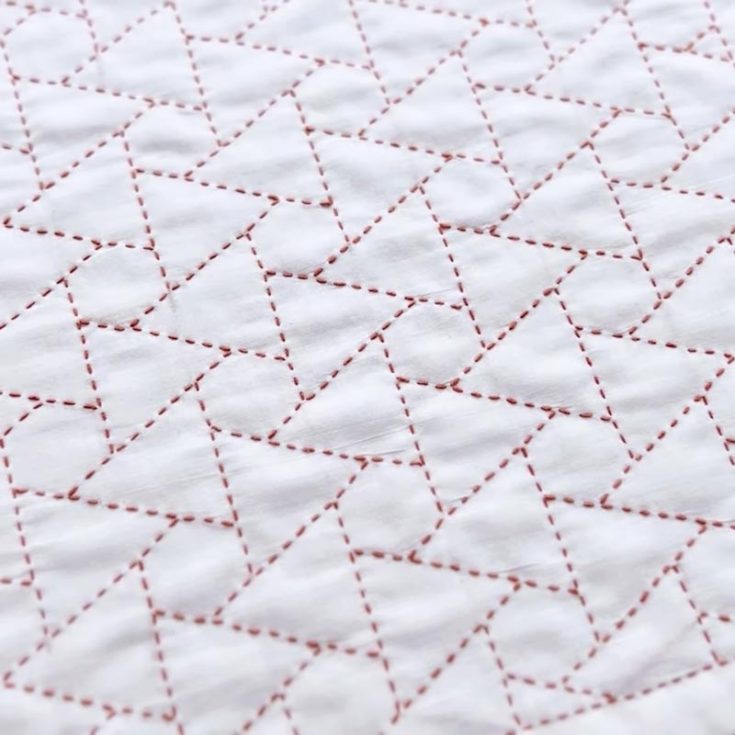 Have a look at this beginner-friendly Sashiko stitching pattern. It only consists of repeated patterns of triangles and hexagons, though it can be quite tricky to perfect. You can make this stitching into reusable items such as tablecloths, coasters, and many more.&nbsp;