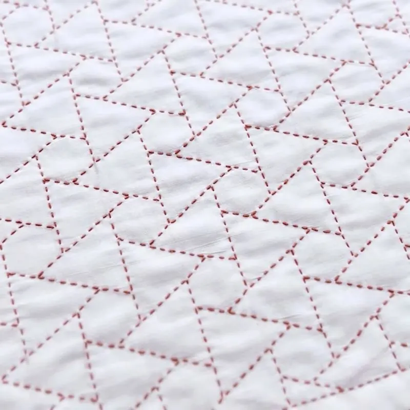 Have a look at this beginner-friendly Sashiko stitching pattern. It only consists of repeated patterns of triangles and hexagons, though it can be quite tricky to perfect. You can make this stitching into reusable items such as tablecloths, coasters, and many more.&nbsp;