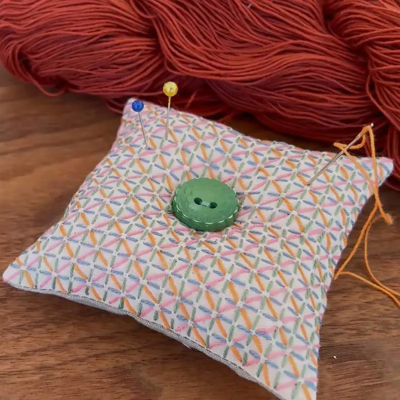Begin elevating your sewing game with this Sashiko pincushion design. This adorable accessory adds a spark of joy to your stitching journey by making every stitch into a mini-masterpiece.&nbsp;