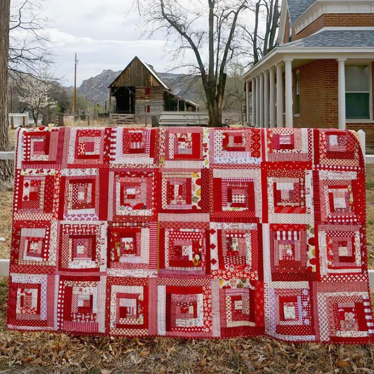 Let&rsquo;s talk about this delightful scrappy log cabin quilt design. This phenomenal piece uses the wonky log cabin block, which consists of fabric strips that are wider on one end and thinner on the other. Give it a try!