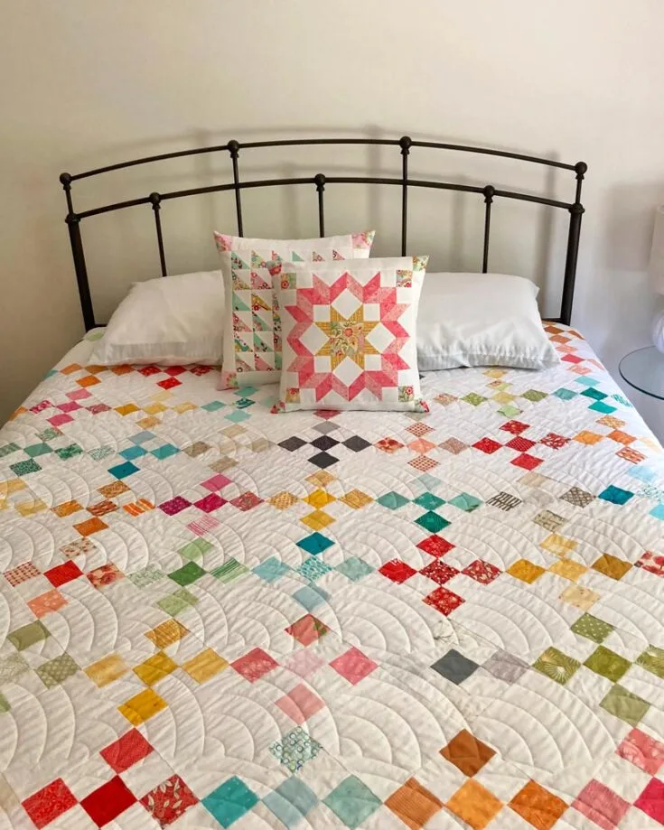 Check out this stunning and straightforward Scrappy On Point 9 Patch quilt! This colorful quilt combines the timeless appeal of the nine-patch block with the dynamic on-point setting, resulting in a stunning piece that is both easy to assemble and visually striking. It&rsquo;s a huge quilt, so be ready for the endless snuggles and cuddles by the fireplace. The finished queen-sized quilt is 97&rdquo; x 106&rdquo;.