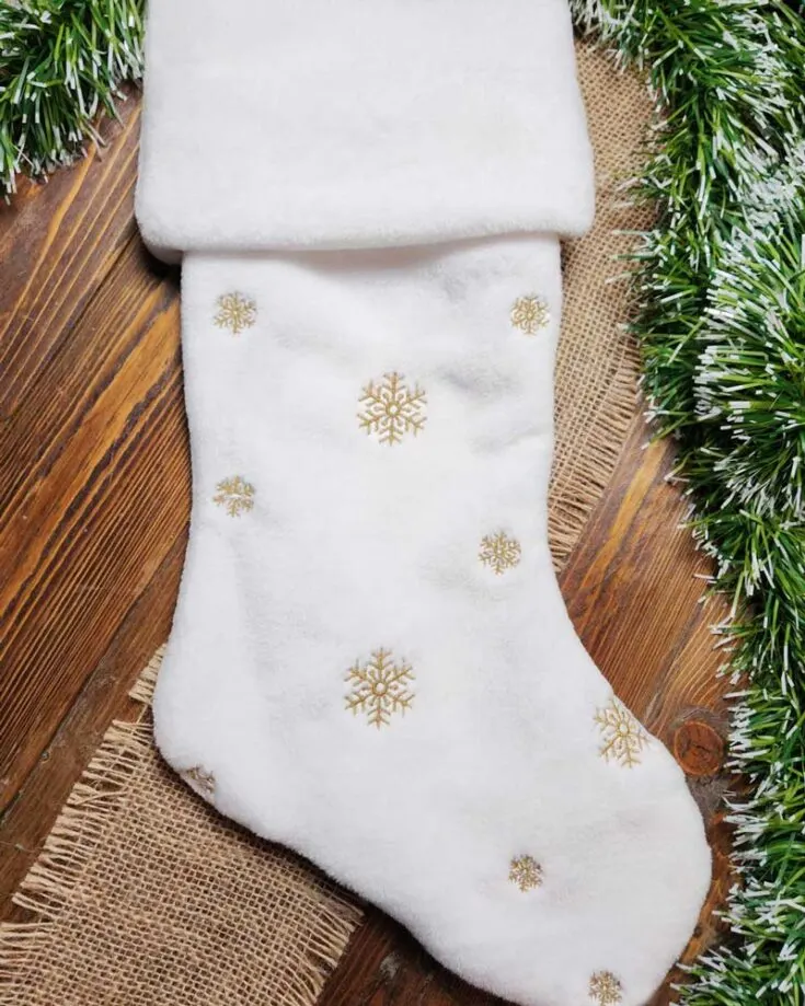 Can&rsquo;t get enough of white Christmas? Add a touch of snow to your stocking pattern with this adorable sew Christmas stocking pattern to hang on by your chimney with a touch of DIY flair.