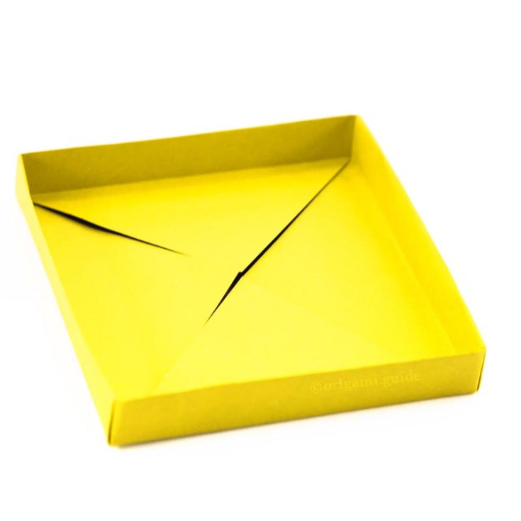 This shallow origami box is perfect for the living room. Put your remotes, keys and wallets in it and never fear losing them again! Its simplicity also makes it so that it complements any interior!