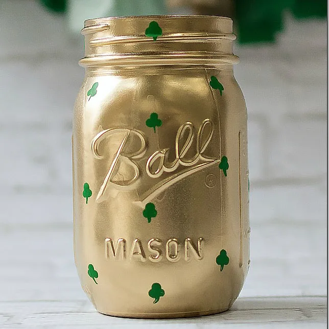 Here is another shamrock mason jar design that you could try out for measure. This fun DIY project could be used as a recycled pot of gold or simply for a cold and comforting beverage during spring.
