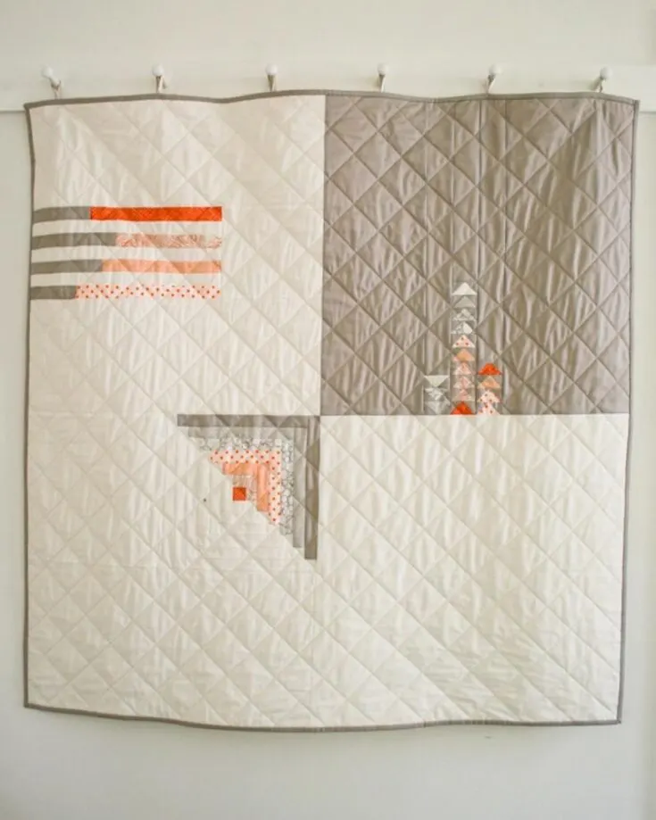 Here&rsquo;s another minimalistic take on the classic log cabin quilt designs. It uses traditional log cabin block in the corner piece and explores light variations of colors and proportions. Doesn&rsquo;t it look like an abstract art painting? The finished size is 48&rdquo; x 48&rdquo;.&nbsp;