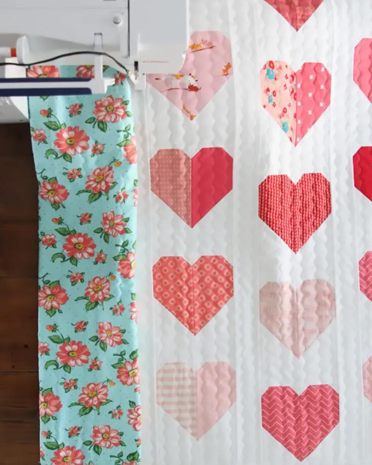 Learn to make these simple heart quilt blocks that result in an elegant quilt. This pattern promises a fast and easy sewing project, yielding a 42&rdquo; x 44&rdquo; quilt.