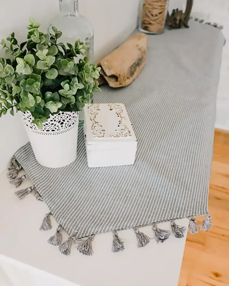Whip up a simple sewn table runner by clicking the link below! It features soothing striped fabric and trimmed tassels to add a little pizzazz to elevate the look, and it's perfect to use for any occasion.&nbsp; Table runner size: Adjustable