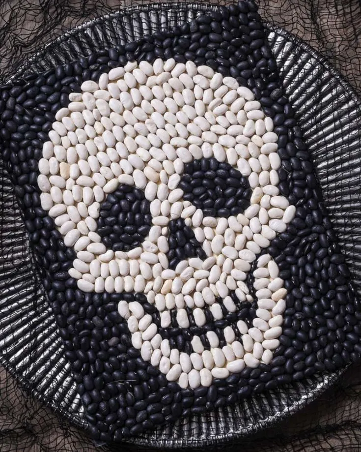 Use some beans and "spice" up your Halloween decor! Paint them black and white to symbolize the iconic skull that is represented timelessly on Halloween. You can even shake them up to form a puzzle, which is fun!
