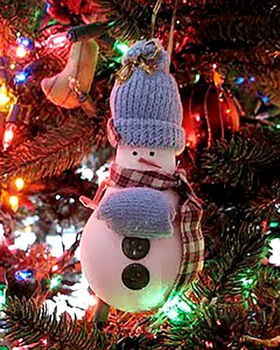 Get the beautiful DIY Light Bulb Christmas Ornaments tutorial here to make a snowman ornament for the Christmas Tree.