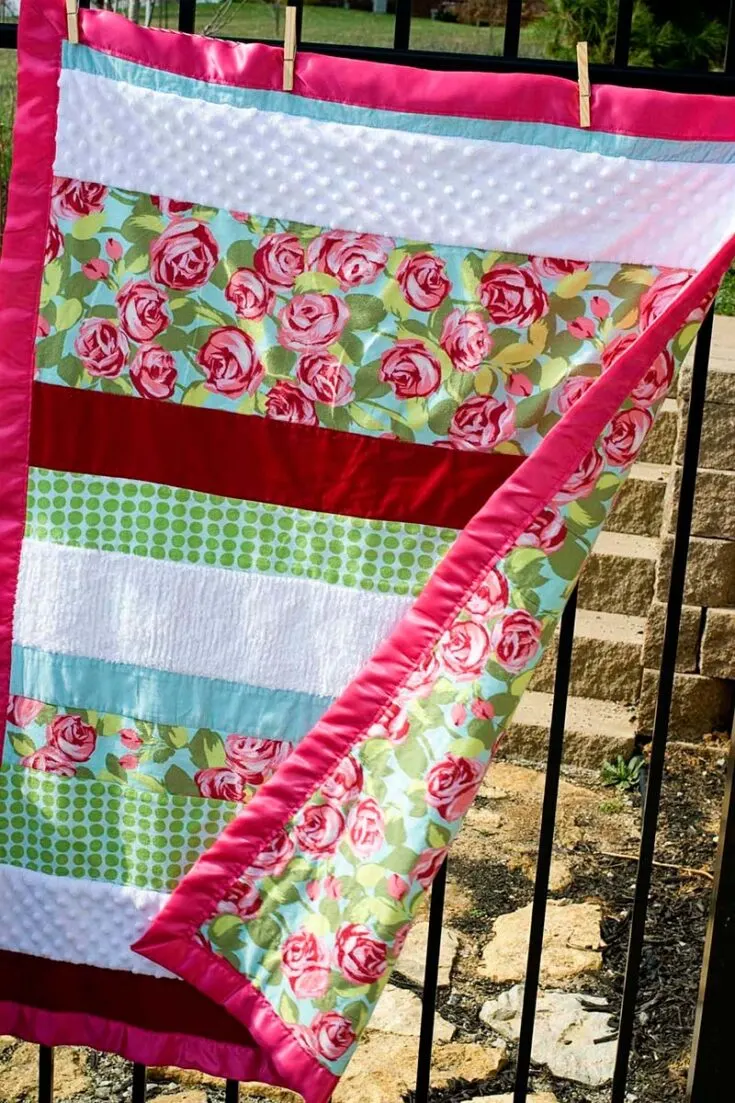 If you're running out of time to make a gift for an upcoming baby shower event, look no further! Just sew a few strips of soft-textured fabrics together and you've got yourself a pillowy quilt.