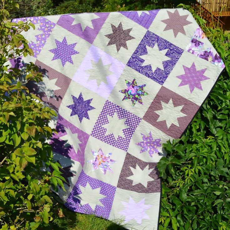 Don&rsquo;t you just love how gorgeous and elegant this Sparkly Stars quilt is? This purple-themed quilt offers a dazzling array of star blocks in various styles, creating a striking, one-of-a-kind quilt that&rsquo;s timeless and modern! Click the link below to learn how to make this quilt in your desired size. Though the finished size of this quilt is 67 &frac12;&rdquo; x 81&rdquo;, the downloadable PDF offers 6 size options.