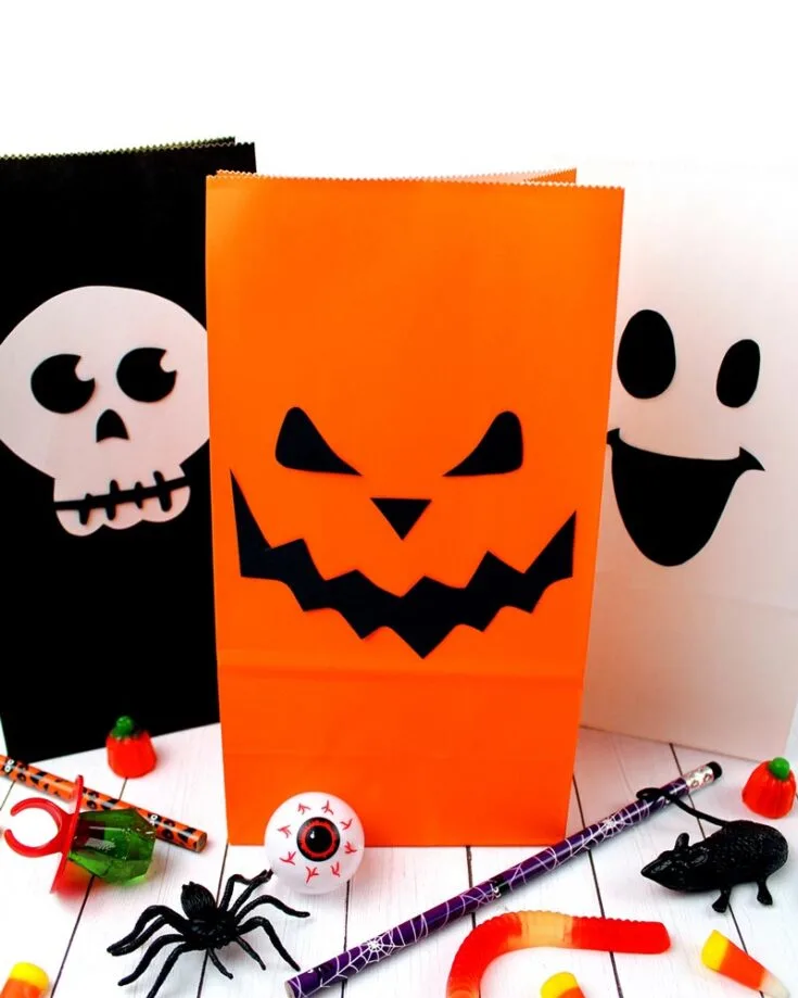 Whip up these cute Halloween paper bags with spooky faces using black and white cardstock, colorful paper bags, glue, and scissors. They&rsquo;re so simple that you can have them ready in under 10 minutes, perfect for last-minute preparations!