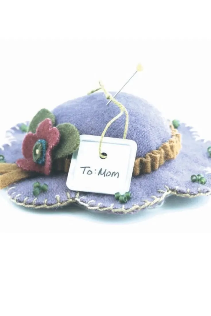 Learn how to make a pincushion with this tutorial. These delicate spring hat cushions are a perfect gift to make and so cute you&rsquo;ll want to save a few for yourself. The flower is a particularly fun detail that makes these spring hats come to life.