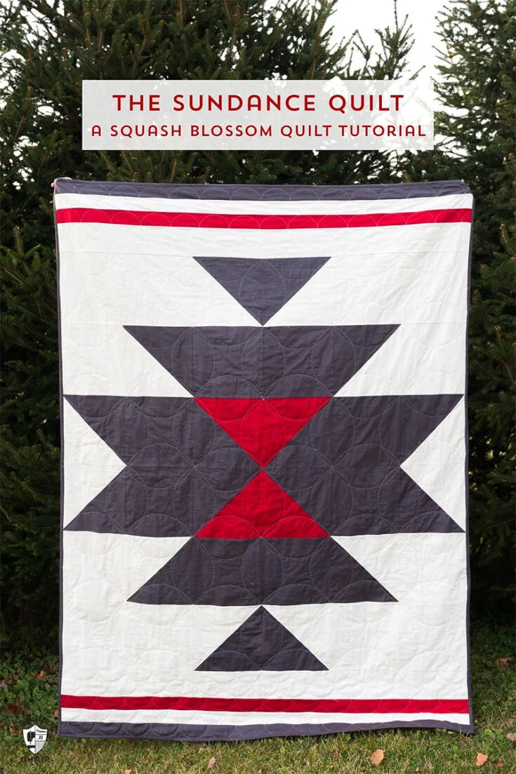 Inspired by the rustic landscapes of the southwest, this squash blossom quilt features a color palette of deep reds and starry blues. It's a nine-patch quilt block lined with top and bottom borders! Fun fact: it's called a squash blossom quilt pattern because it portrays the bright orange flowers of squash plants like zucchini!