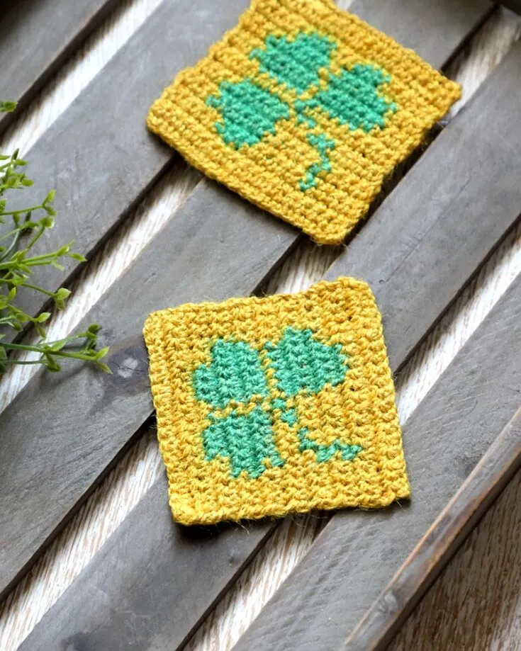 With only two colored yarns, you can make your very own crochet shamrock coasters! Our pattern allows for other types of crafts such as embroidering, cross-stitching, and or knitting. Try it out now.