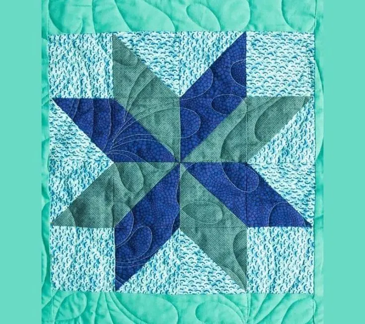 This dazzling Star Flower block pattern is pretty straightforward to piece together. All you have to do is assemble some HSTs to make this eight-pointer flower! Its pinwheel center gives it alternating shades of petals.