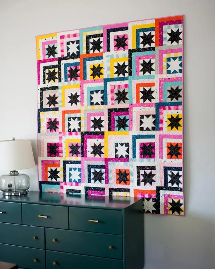This log cabin design takes on a modern twist with the lovely combination of sawtooth stars. It&rsquo;s visually captivating, and the star pattern is stash-friendly, too! For $12.00, this pattern is suitable for ambitious beginners and offers detailed instructions in the PDF. It also provides sizes from baby quilts to queen-size bed quilts.