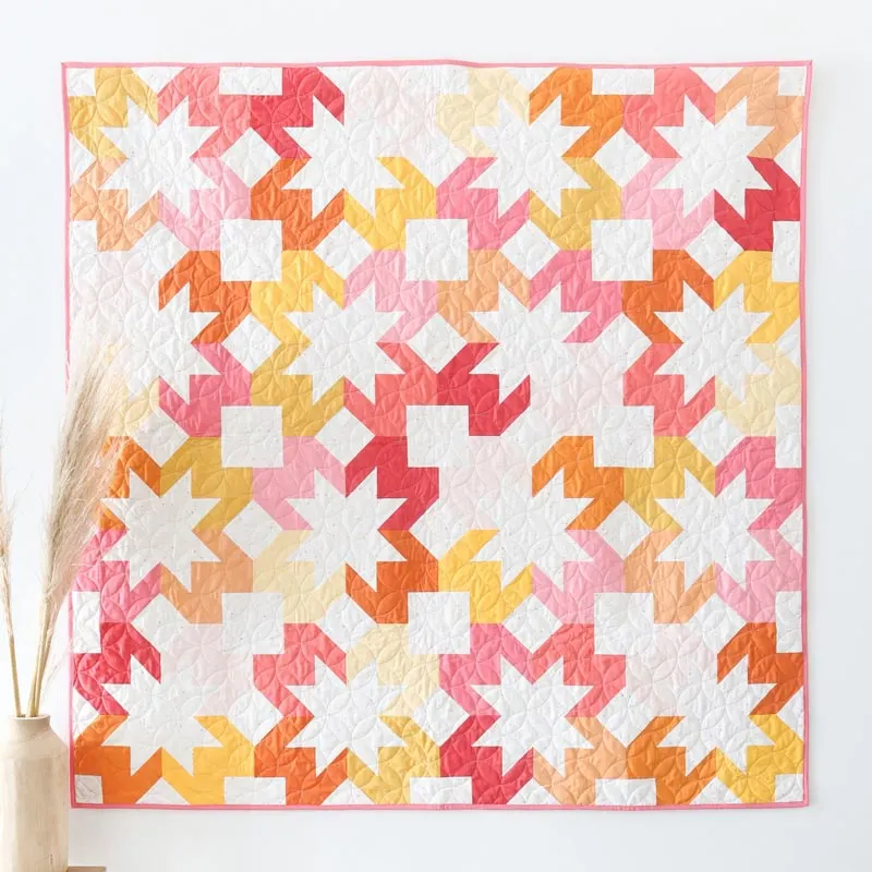 Learn to make this gorgeous and summery quilt called the Starlight Quilt pattern! This pattern comes at a reasonable price and is suitable for quilters of all skill levels. Whether you&rsquo;re a novice seeking a new project or an experienced quilter looking for a relaxing endeavor, this pattern promises to inspire creativity and bring a touch of celestial charm to your home. It comes in four available sizes as follows: Baby (45&rdquo; x 45&rdquo;) Throw (60&rdquo; x 60&rdquo;) Twin (75&rdquo; x 90&rdquo;) Queen (90&rdquo; x 90&rdquo;)