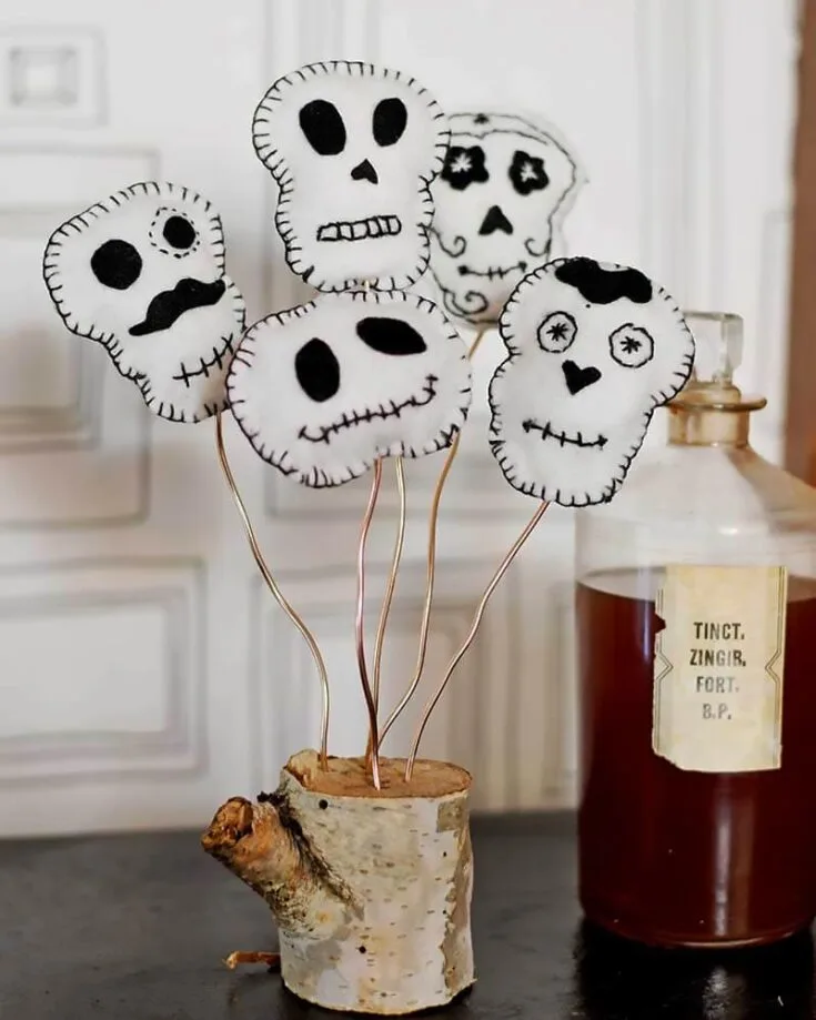 Last but not least, we have some felt decor. It's a sewing project; feel free to use different colored embroidery thread or make different faces to personalize it! The choice is yours when it comes to these decorations!