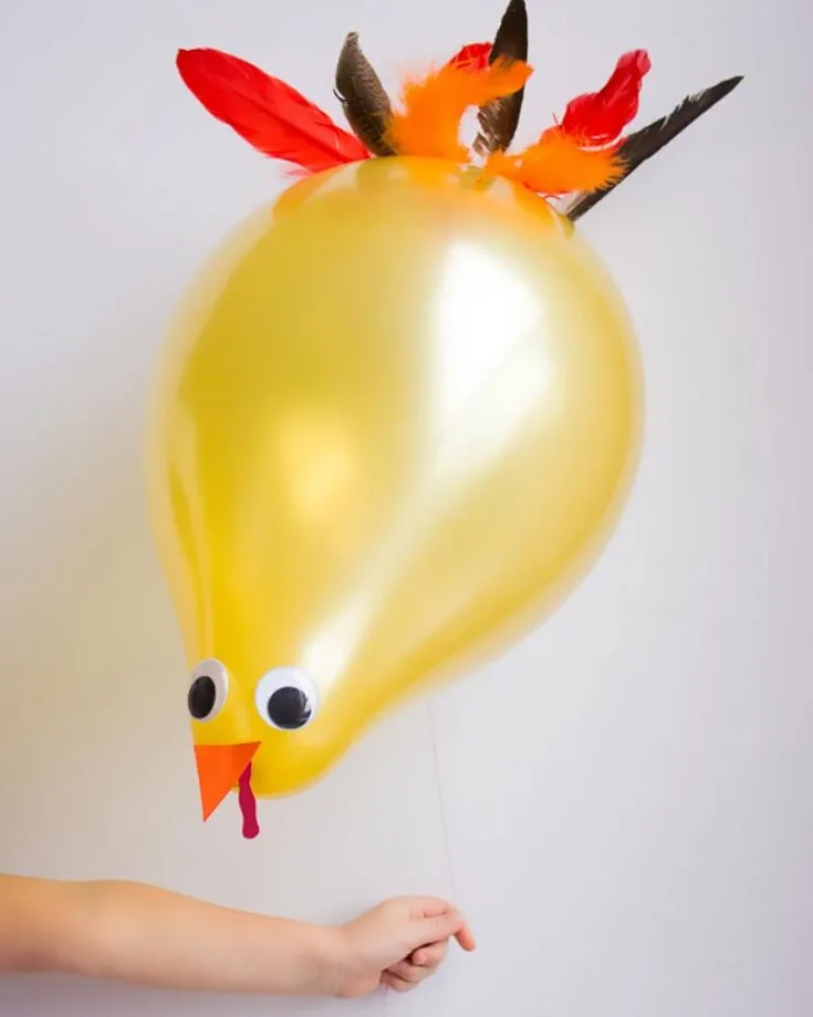 Visit your local party shop or use balloons that you have at home. It is highly adaptable, making it suitable for Thanksgiving decor or a turkey-themed birthday. Watch as your turkeys take flight and float!