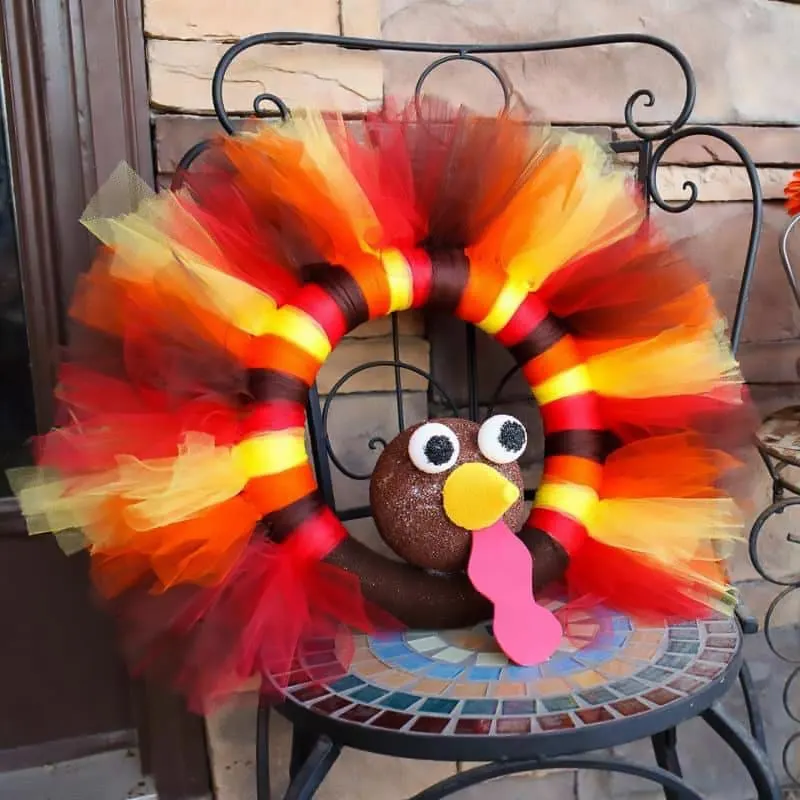 Running out of Thanksgiving decor for your house? Fret not, as we got you covered with this craft! It features a beautiful wreath with vibrant colors to attract the holiday cheer to your doorstep.