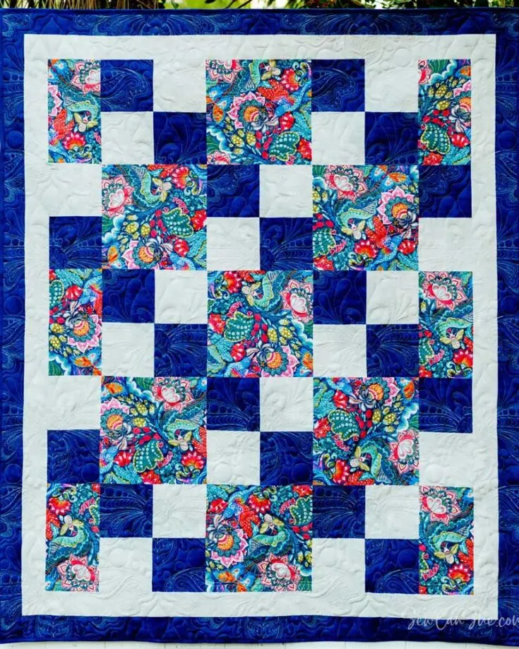 Recreate this stunning striking blue Three Yard Quilt by clicking the link below! Like its name, this design uses only three yards of fabric to create a beautiful, cozy quilt with minimal effort and fuss. Whether you&rsquo;re looking to make a wall hanging, a gift for your loved ones, or to use it daily, this gorgeous quilt promises warmth and comfort all day. The finished size of this throw quilt is 54&rdquo; x 65&rdquo;.