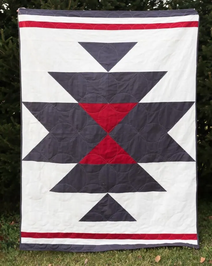 Check out this simple, geometric Sundance Quilt pattern by Polka Dot Chair! It&rsquo;s chic, elegant, and so easy to make as it features three colors. Made with half-square triangle blocks, it&rsquo;s a relatively fast project you can complete over a few days. It will be the perfect opportunity to hone your quilting skills and an enjoyable project that brings a touch of timeless beauty to any home decor. The final measurements are 58&rdquo; x 74&rdquo;.