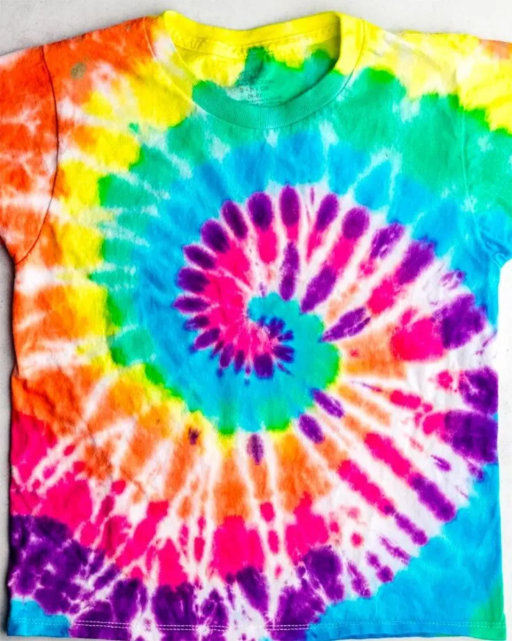 The spiral is a classic tie dye pattern. It is a vibrant spiral design that radiates outwards from the center in a diagonal fashion.