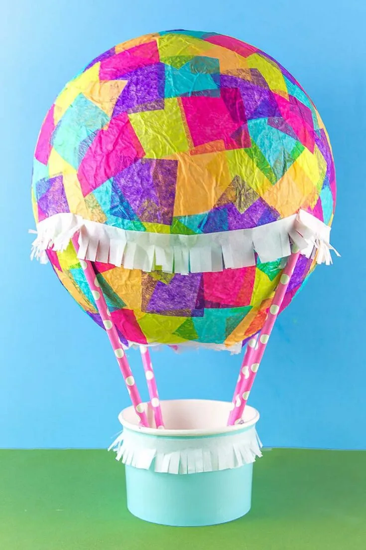 If you're not into painting on your paper mache projects, try making this hot air balloon out of colorful tissue paper instead.