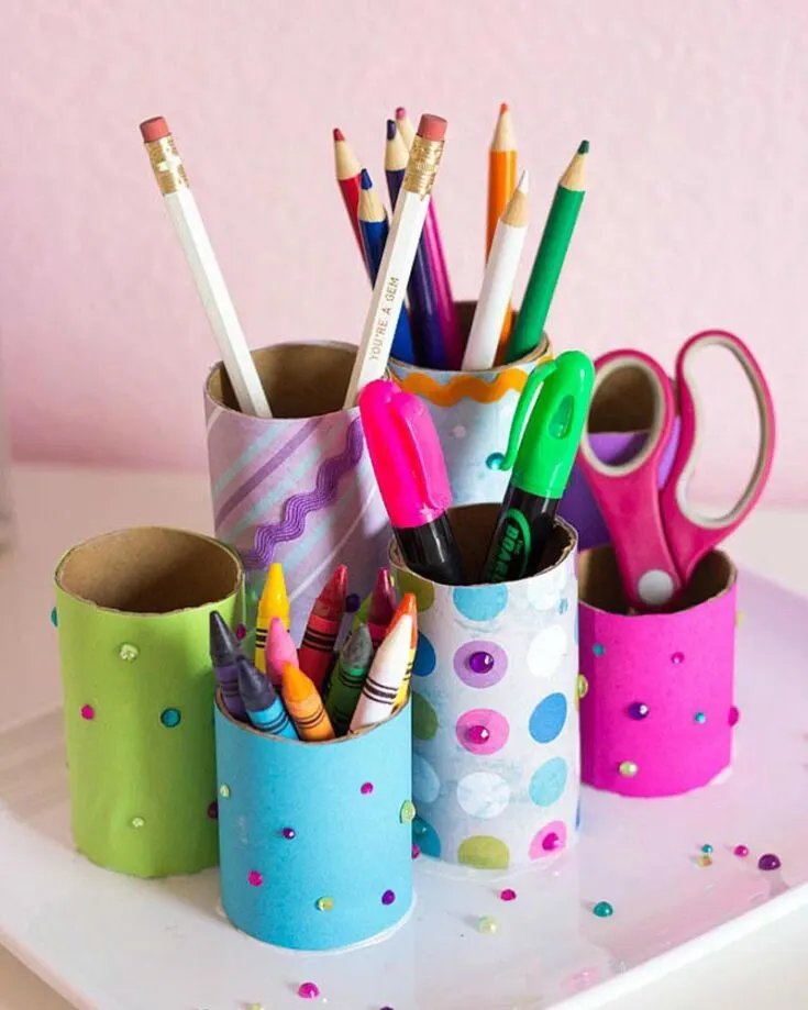 Is your desk getting a little messy? Craft this easy DIY desk organizer using toilet paper tubes. Decorate them with wrapping paper, washi tape, and craft jewels to add a crafty charm to your study desk.
