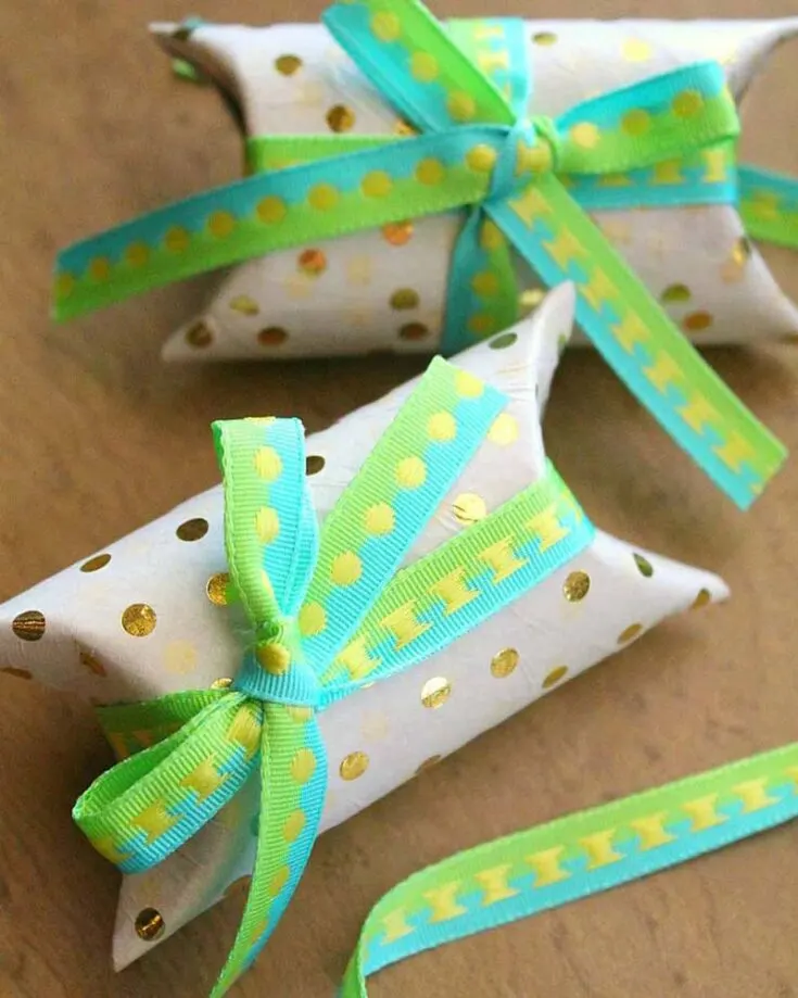 Hand out party favors in style with these DIY gift boxes made from recycled toilet paper rolls! Cut the rolls into smaller sections, then decorate them with wrapping paper, ribbon, and embellishments for a personalized touch.