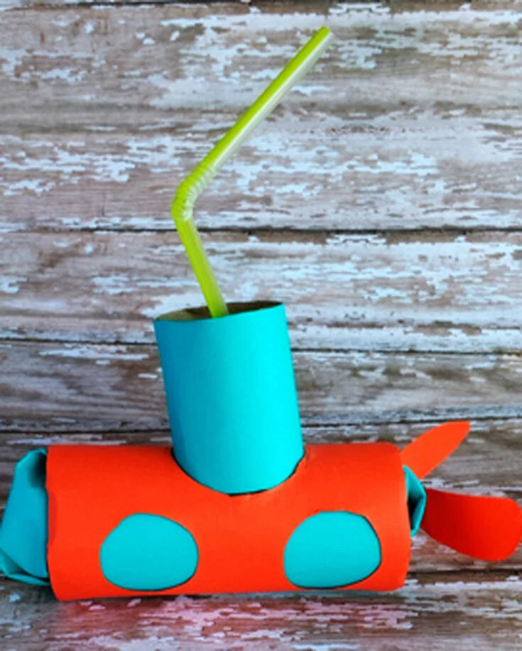 Embark on an underwater adventure with this toilet paper roll submarine craft! Paint and decorate your submarine with portholes, a periscope recycled from a straw, and paper propellers.